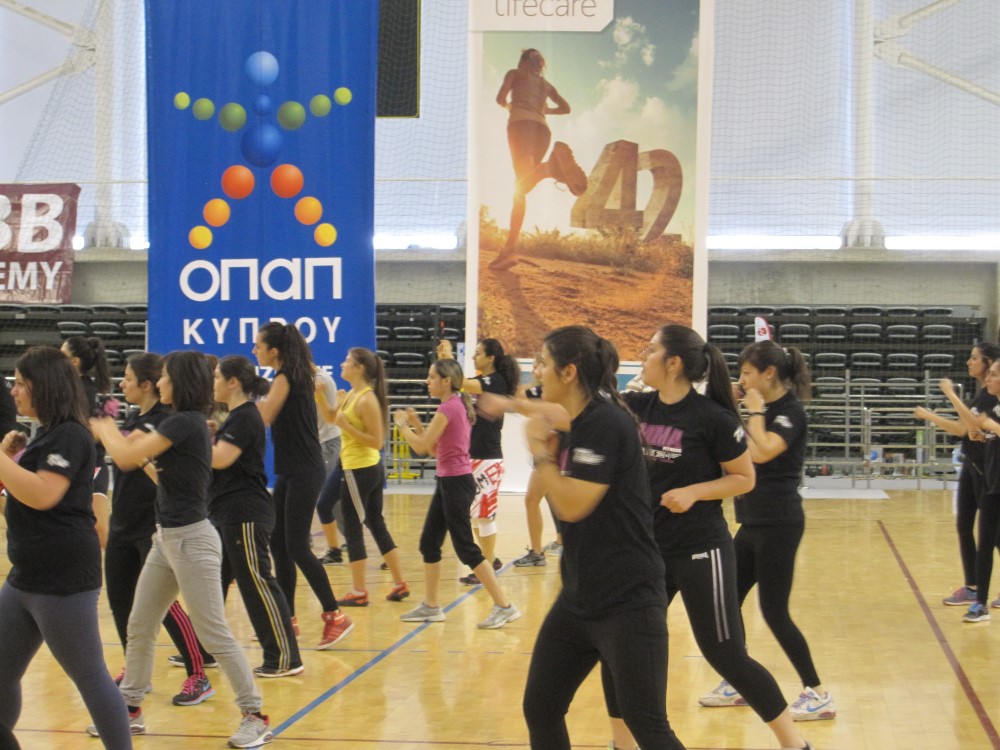 People exercising in gym.